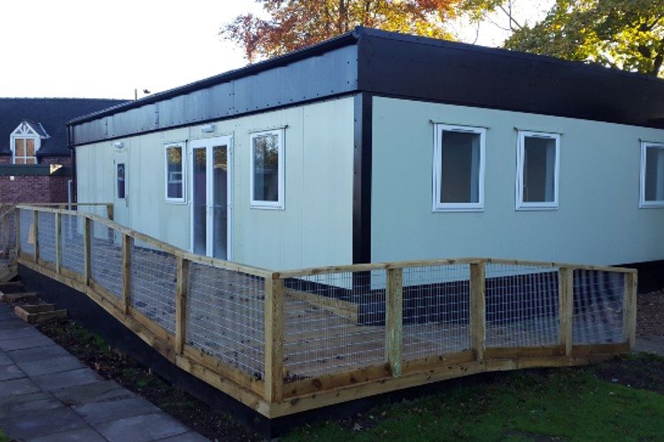 Existing modular building refurbished with new cladding and an access ramp