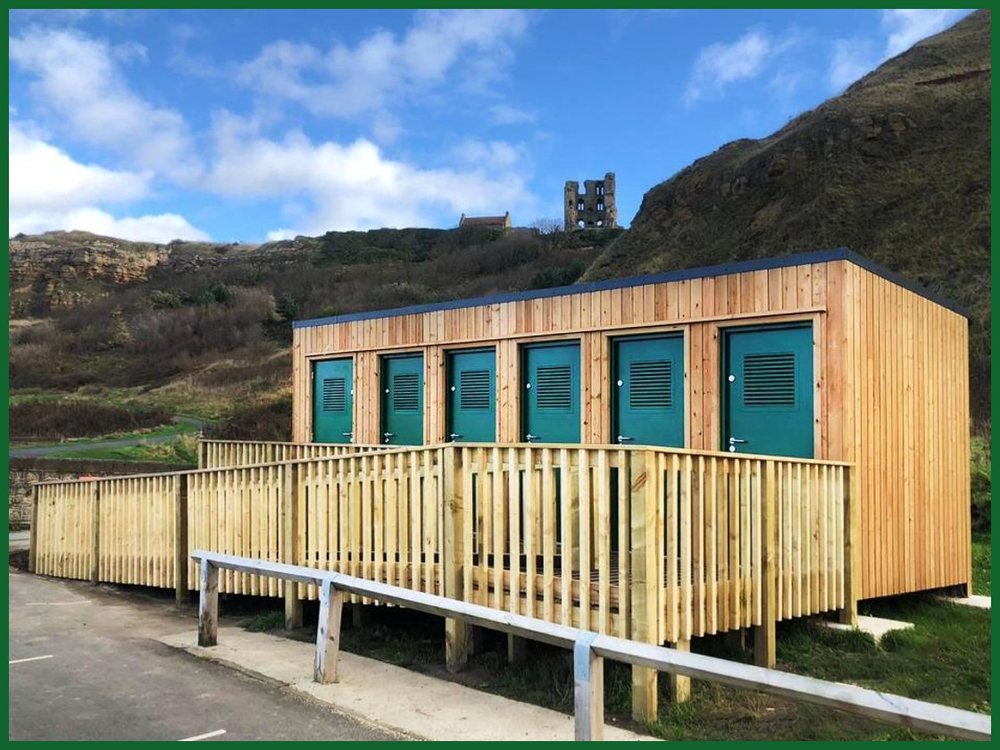 Timber-clad campsite toilet block with accessible ramp